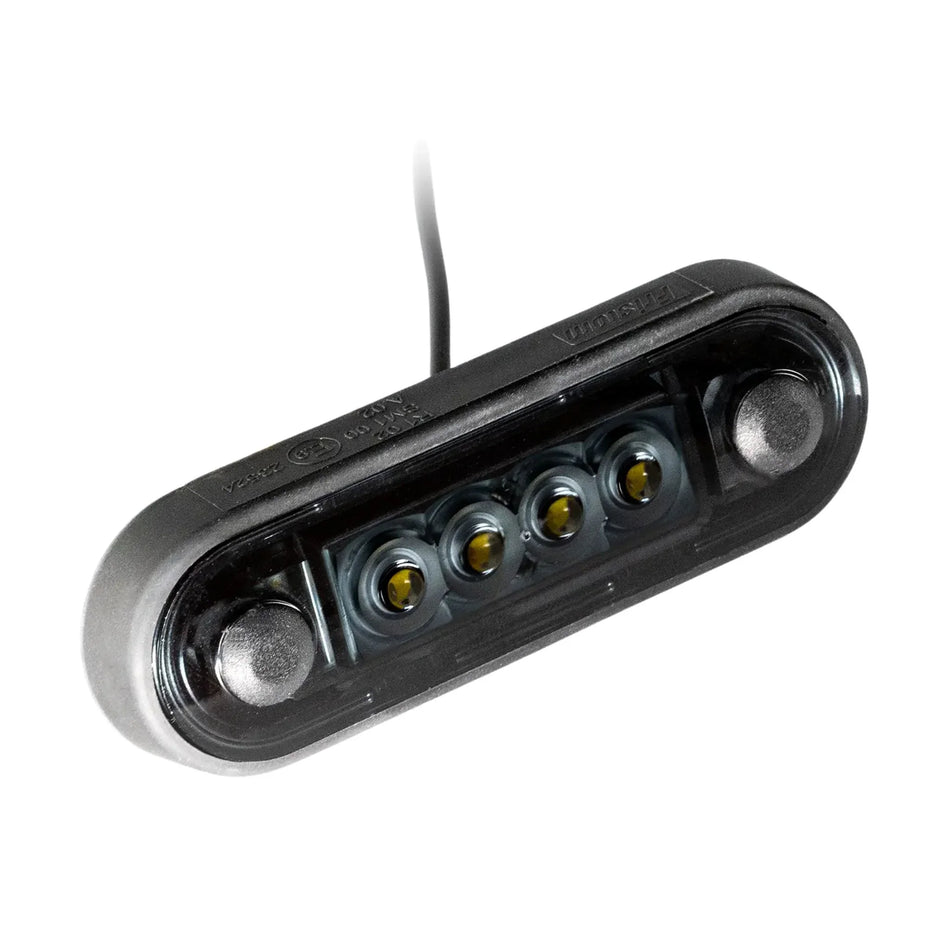 Rectangular black LED strobe light with four bulbs and attached wire on white background