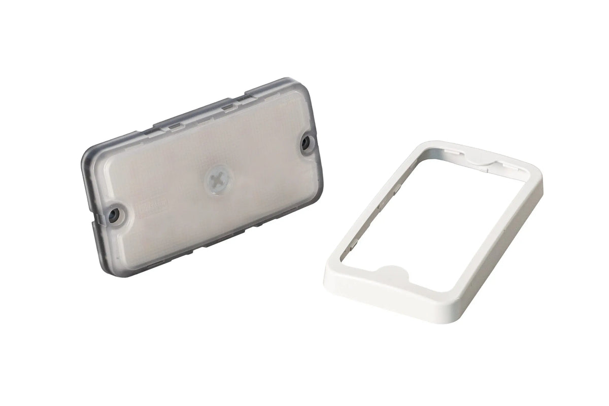 Rectangular LED light fixture with a translucent cover and separate white mounting frame